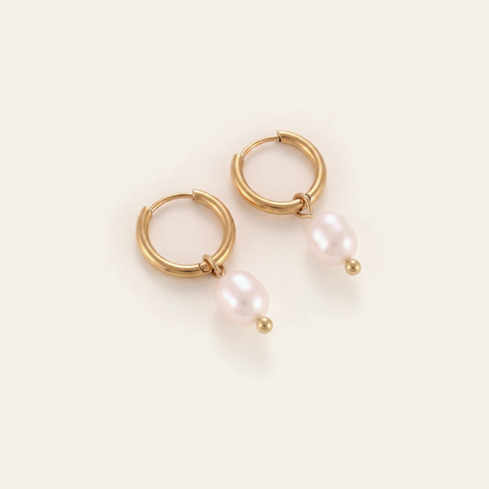 Gold hoop earrings with green stone drops