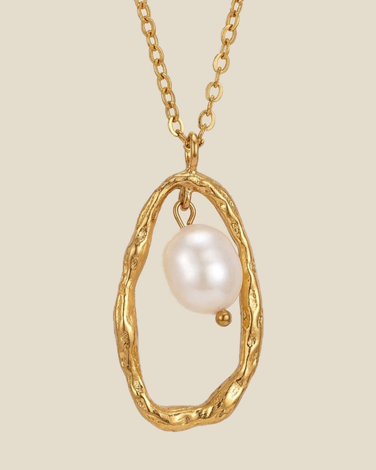 Freshwater pearl suspended in an open gold-tone pendant frame on a fine chain